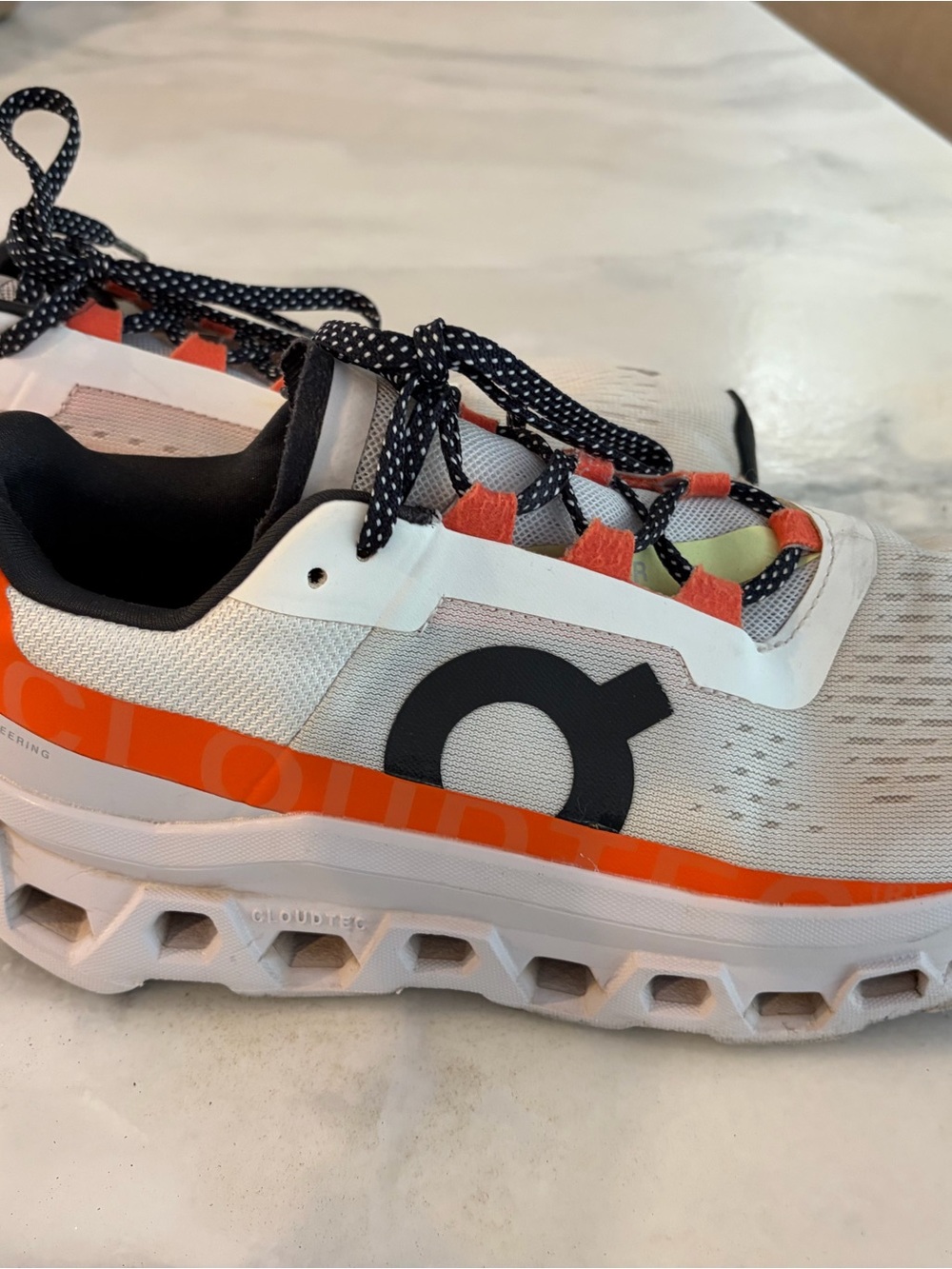 On Running White and Orange Women's Cloud-Style Athletic Shoe